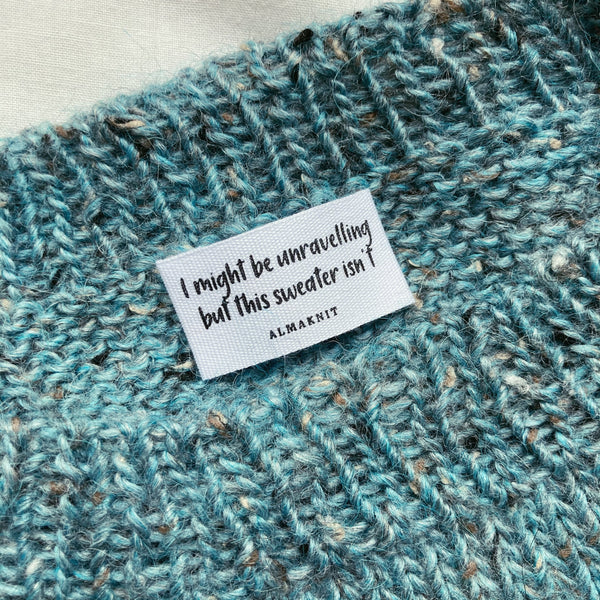 tweed strikvest med bomuldslabel fra AlmaKnit